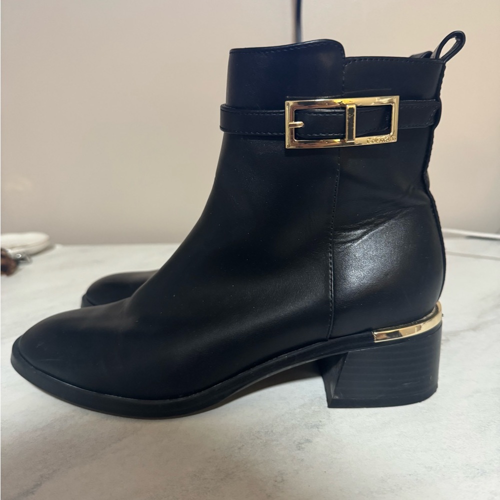 Calvin Klein Jallis2 Black Ankle Boots with Gold Accent